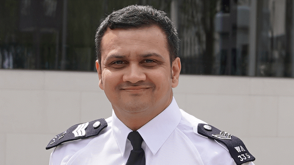 Sergeant Keyur Patel smiling to camera.
