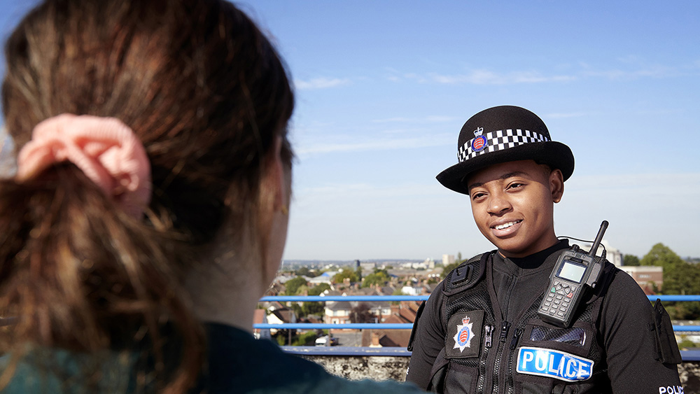 Female officer smiling.