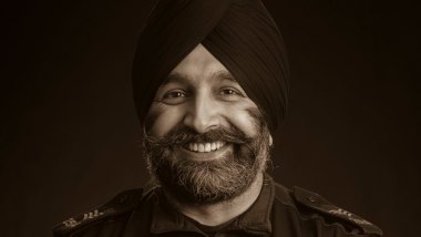 Sergeant Harvy Rai smiling to camera.